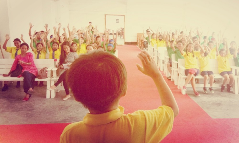 Deaf students give a silent applause on International Week of Deaf People, 2019